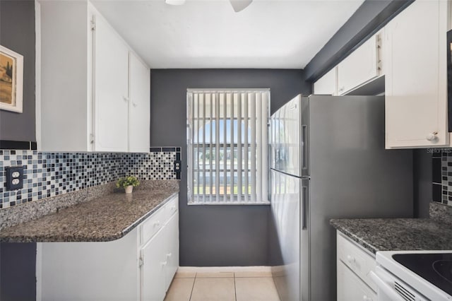 4229 Glissade Dr, New Port Richey, FL 34652 - kitchen featuring white cabinetry, dark countertops, and tasteful backsplash