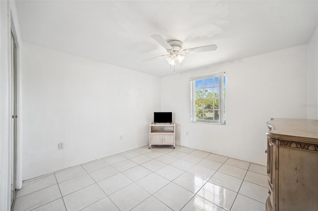 4229 Glissade Dr, New Port Richey, FL 34652 - unfurnished bedroom featuring light tile patterned floors and a ceiling fan