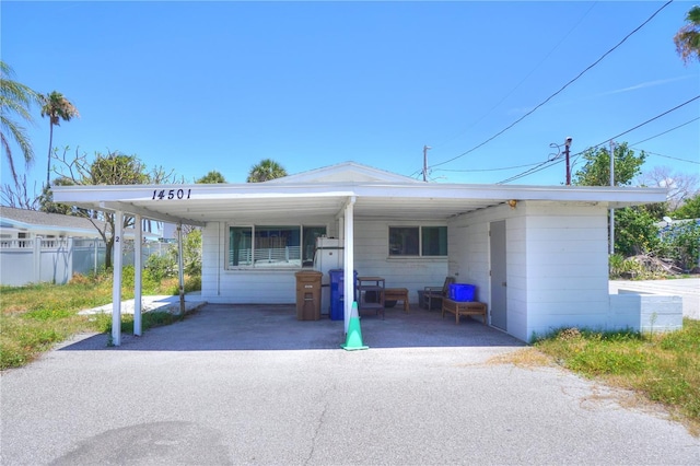14501 N Bayshore Dr, Madeira Beach, FL 33708 - view of front of home with an attached carport