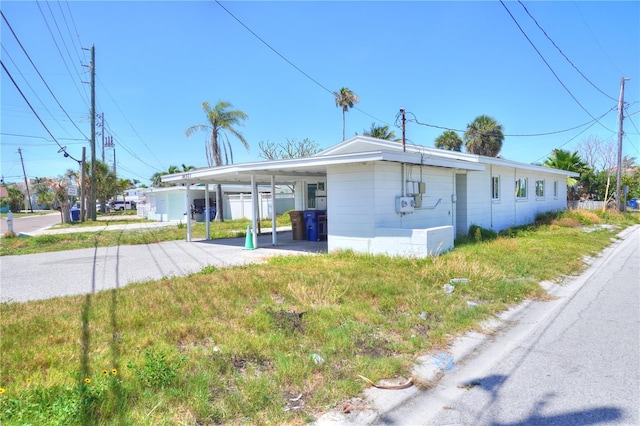 14501 N Bayshore Dr, Madeira Beach, FL 33708 - view of front of property with a carport and driveway
