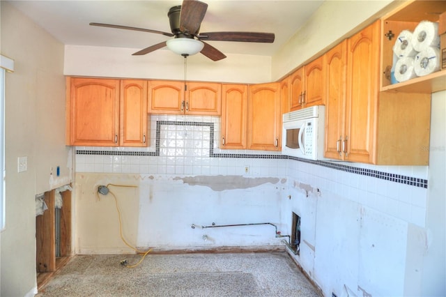 14501 N Bayshore Dr, Madeira Beach, FL 33708 - kitchen featuring white microwave and ceiling fan