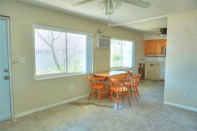 14501 N Bayshore Dr, Madeira Beach, FL 33708 - dining space featuring ceiling fan, baseboards, and a wall mounted AC