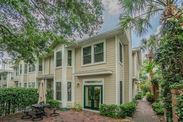 350 2nd St N Unit 1, Saint Petersburg, FL 33701 - back of property featuring french doors and a patio