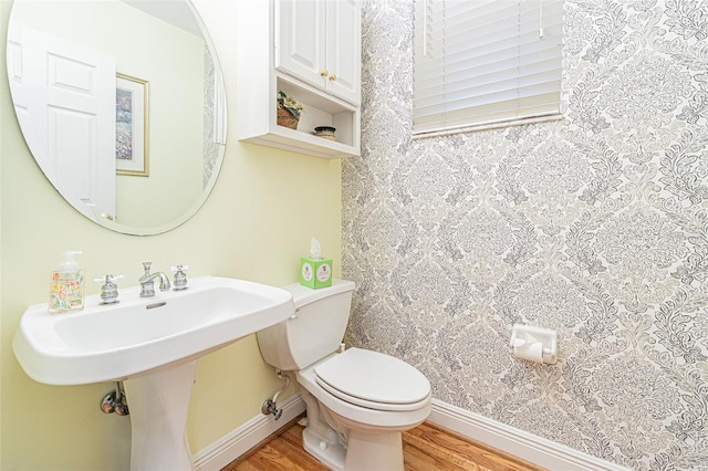 350 2nd St N Unit 1, Saint Petersburg, FL 33701 - half bath featuring wood finished floors, toilet, and baseboards