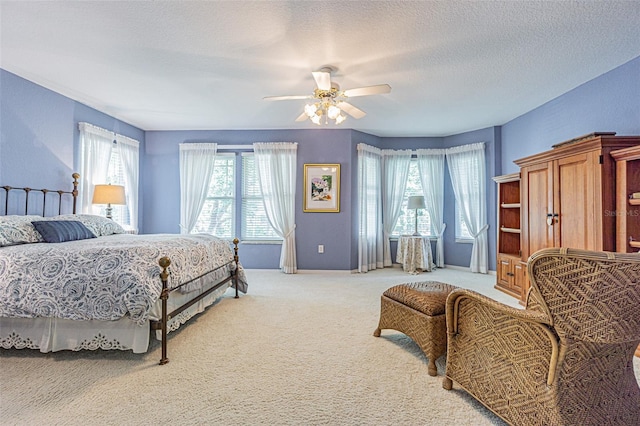 350 2nd St N Unit 1, Saint Petersburg, FL 33701 - bedroom featuring light carpet, a textured ceiling, ceiling fan, and baseboards