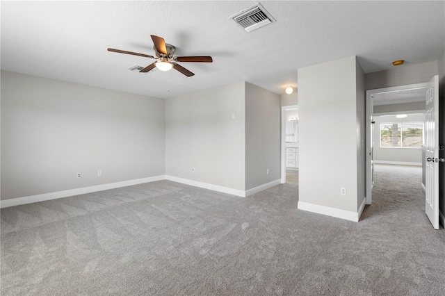 4852 Trinidad Dr, Land O Lakes, FL 34639 - empty room with carpet, a ceiling fan, and baseboards