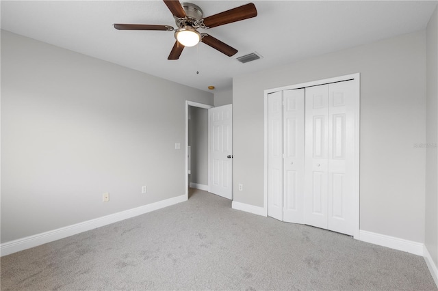 4852 Trinidad Dr, Land O Lakes, FL 34639 - unfurnished bedroom featuring carpet floors, a closet, baseboards, and a ceiling fan