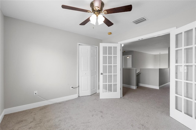 4852 Trinidad Dr, Land O Lakes, FL 34639 - unfurnished bedroom featuring carpet flooring, baseboards, french doors, and a closet