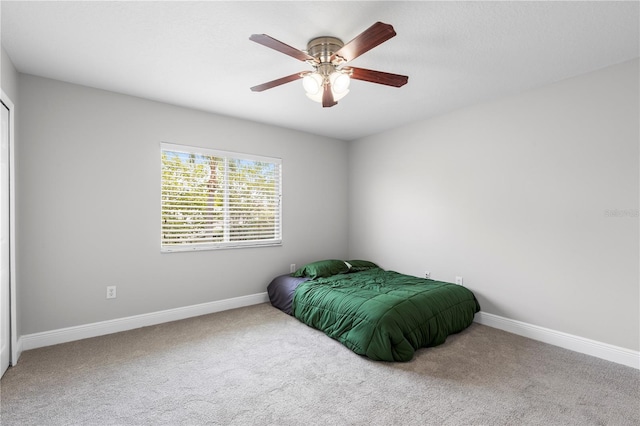 4852 Trinidad Dr, Land O Lakes, FL 34639 - bedroom featuring carpet flooring, baseboards, and ceiling fan