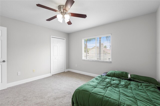 4852 Trinidad Dr, Land O Lakes, FL 34639 - carpeted bedroom featuring baseboards, a closet, and ceiling fan