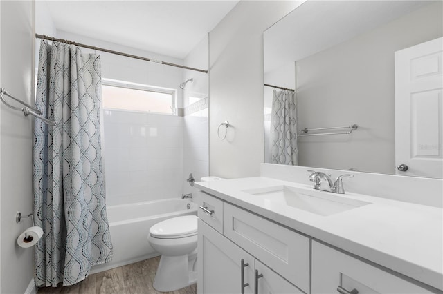 4852 Trinidad Dr, Land O Lakes, FL 34639 - bathroom featuring vanity, toilet, shower / bath combo with shower curtain, and wood finished floors