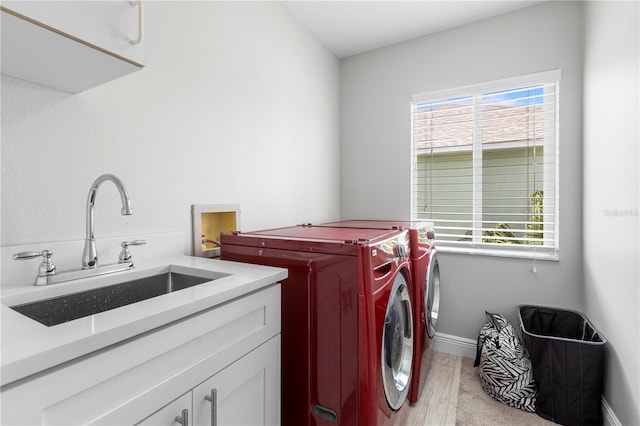 4852 Trinidad Dr, Land O Lakes, FL 34639 - washroom featuring cabinet space, washer and clothes dryer, healthy amount of natural light, and baseboards