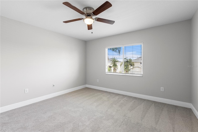 4852 Trinidad Dr, Land O Lakes, FL 34639 - empty room with baseboards, light colored carpet, and ceiling fan