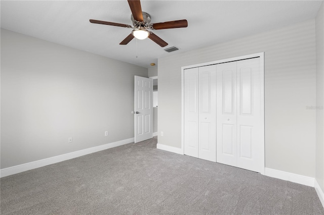 4852 Trinidad Dr, Land O Lakes, FL 34639 - unfurnished bedroom with carpet flooring, baseboards, a closet, and ceiling fan