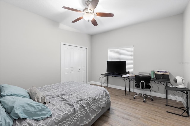 4852 Trinidad Dr, Land O Lakes, FL 34639 - bedroom with wood finished floors, a closet, baseboards, and ceiling fan