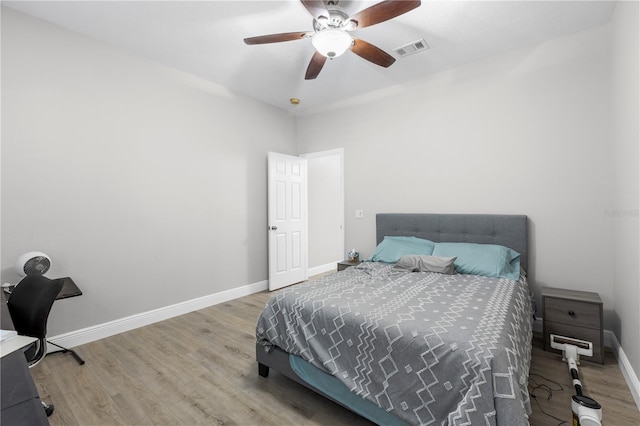 4852 Trinidad Dr, Land O Lakes, FL 34639 - bedroom featuring wood finished floors, baseboards, and ceiling fan