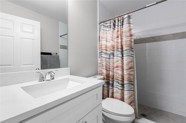 4852 Trinidad Dr, Land O Lakes, FL 34639 - bathroom with vanity, toilet, a tile shower, and a textured ceiling