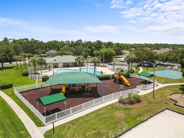 4852 Trinidad Dr, Land O Lakes, FL 34639 - view of community featuring a pool and view of wooded area