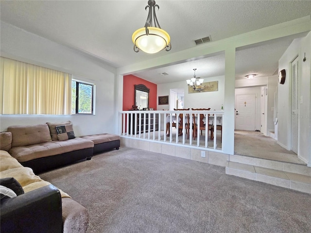 12701 N 57th St -, Unit Tampa, FL 33617 - carpeted living room with a chandelier