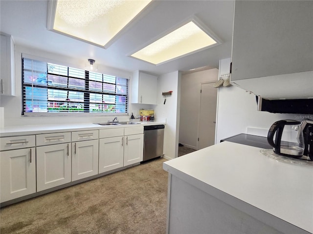 12701 N 57th St -, Unit Tampa, FL 33617 - kitchen with dishwasher, a sink, light carpet, light countertops, and white cabinets