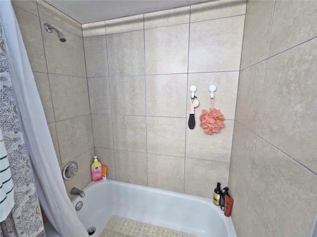 12701 N 57th St -, Unit Tampa, FL 33617 - bathroom featuring shower / bath combo