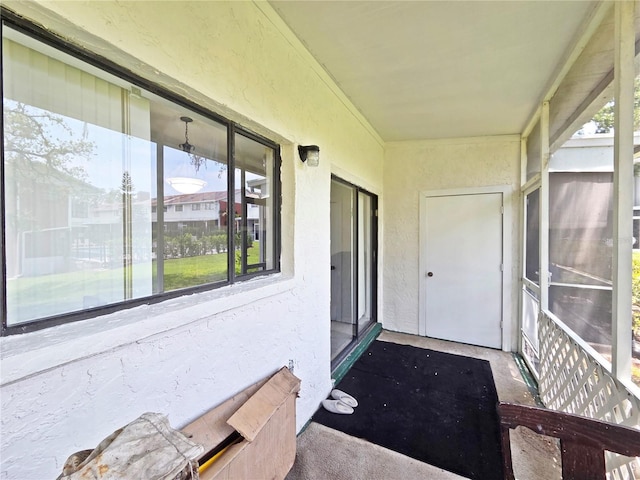 12701 N 57th St -, Unit Tampa, FL 33617 - unfurnished sunroom with plenty of natural light