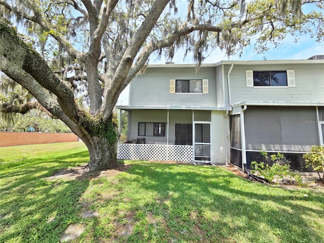 12701 N 57th St -, Unit Tampa, FL 33617 - view of front of property with a front lawn and a sunroom