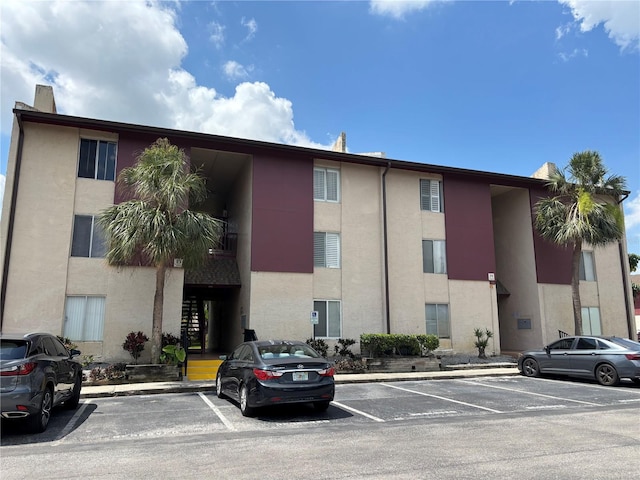3814 N Lake Dr Unit 65, Tampa, FL 33614 - view of building exterior with uncovered parking