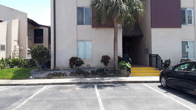 3814 N Lake Dr Unit 65, Tampa, FL 33614 - view of building exterior featuring uncovered parking