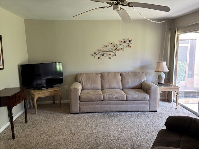 3814 N Lake Dr Unit 65, Tampa, FL 33614 - carpeted living room featuring ceiling fan and baseboards