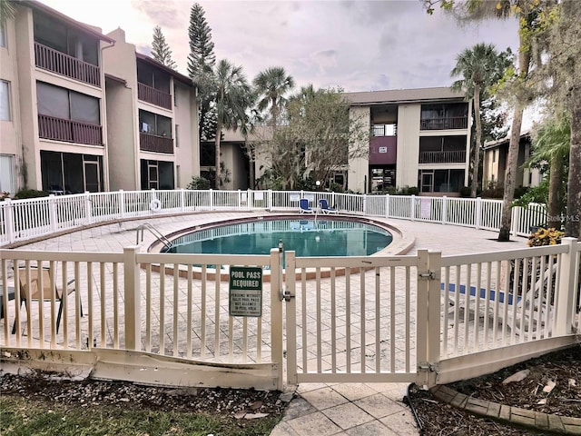 3814 N Lake Dr Unit 65, Tampa, FL 33614 - community pool featuring a gate