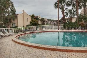 3814 N Lake Dr Unit 65, Tampa, FL 33614 - community pool with a patio area