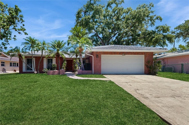 2138 Viola Dr, Clearwater, FL 33764 - ranch-style home with an attached garage, concrete driveway, and brick siding