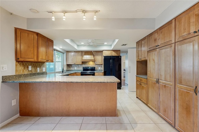 2138 Viola Dr, Clearwater, FL 33764 - kitchen featuring black appliances, a raised ceiling, tasteful backsplash, a ceiling fan, and premium range hood