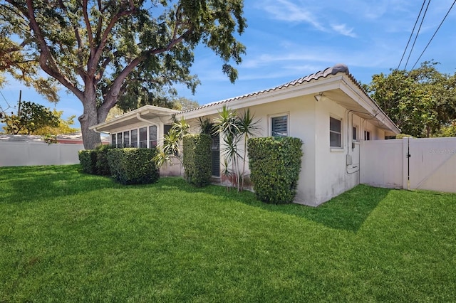 2138 Viola Dr, Clearwater, FL 33764 - view of front of property featuring stucco siding, a gate, and a tiled roof