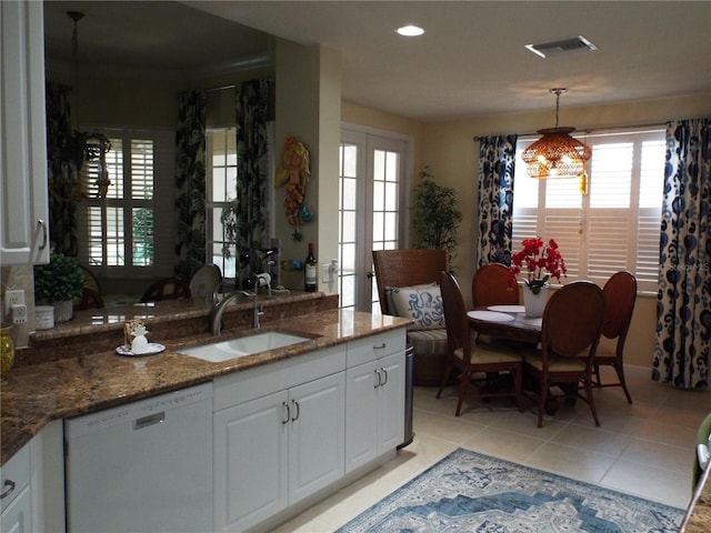 13860 Avon Park Cir Unit 104, Fort Myers, FL 33912 - kitchen featuring dishwashing machine, a sink, healthy amount of natural light, light tile patterned floors, and recessed lighting