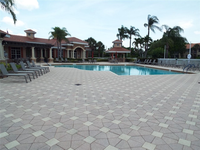 13860 Avon Park Cir Unit 104, Fort Myers, FL 33912 - community pool featuring a patio area and a gazebo
