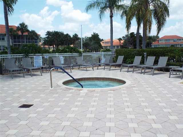 13860 Avon Park Cir Unit 104, Fort Myers, FL 33912 - view of pool featuring a community hot tub and a patio