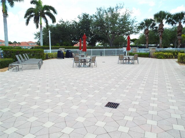 13860 Avon Park Cir Unit 104, Fort Myers, FL 33912 - view of community featuring outdoor dining area and a patio area