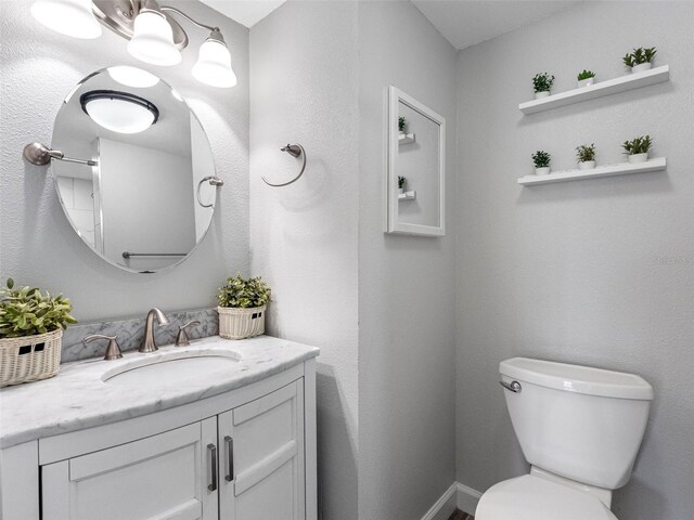 10356 Carrollwood Ln Unit 204, Tampa, FL 33618 - half bathroom featuring vanity and toilet