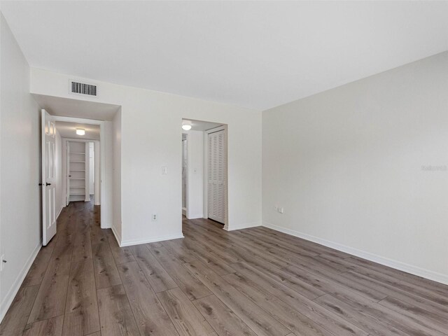 10356 Carrollwood Ln Unit 204, Tampa, FL 33618 - unfurnished room with wood finished floors and baseboards
