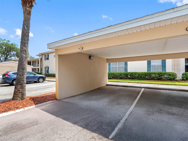 10356 Carrollwood Ln Unit 204, Tampa, FL 33618 - view of partially covered parking lot