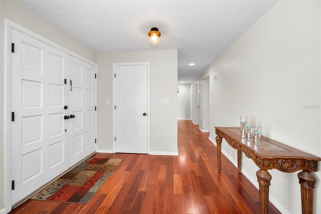 14341 Passage Way, Seminole, FL 33776 - entrance foyer featuring wood finished floors, baseboards, and recessed lighting