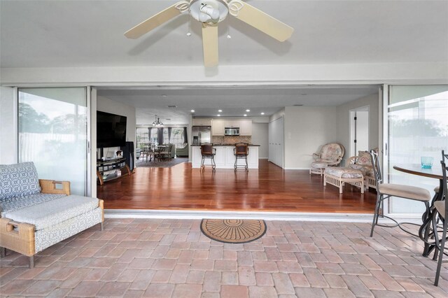 14341 Passage Way, Seminole, FL 33776 - living area with ceiling fan