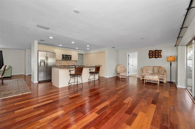 14341 Passage Way, Seminole, FL 33776 - living room with dark wood-style floors, recessed lighting, and baseboards