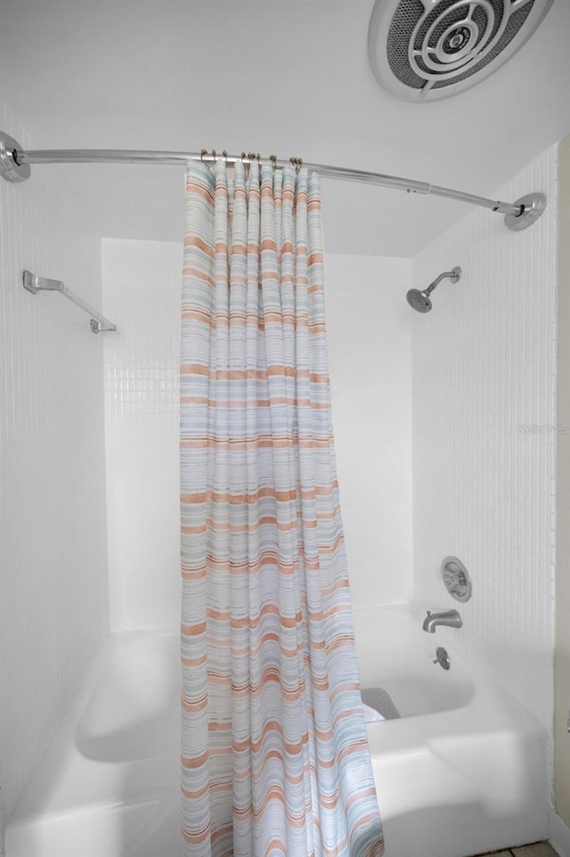 14341 Passage Way, Seminole, FL 33776 - full bathroom featuring shower / bath combination with curtain