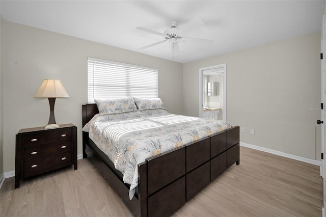 14341 Passage Way, Seminole, FL 33776 - bedroom with light wood-style floors, baseboards, and a ceiling fan