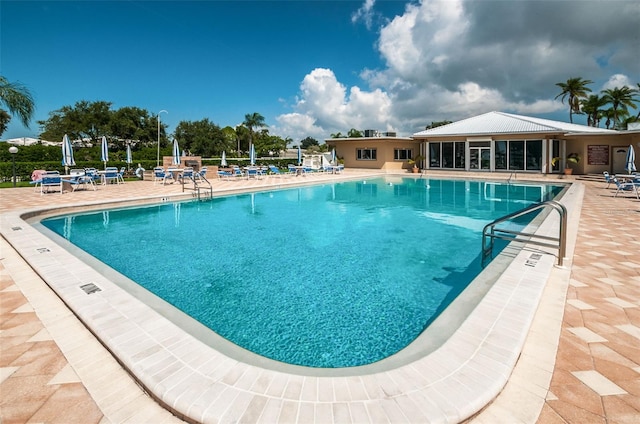 14341 Passage Way, Seminole, FL 33776 - community pool featuring a patio area