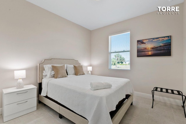 14024 Wenzel Ave, Port Charlotte, FL 33981 - bedroom featuring baseboards and light tile patterned flooring