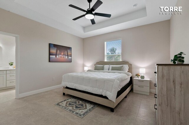 14024 Wenzel Ave, Port Charlotte, FL 33981 - bedroom featuring a raised ceiling, baseboards, ensuite bathroom, and a ceiling fan